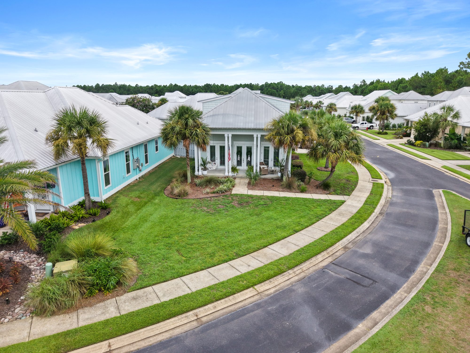 Aerial view of a coastal home and neighborhood