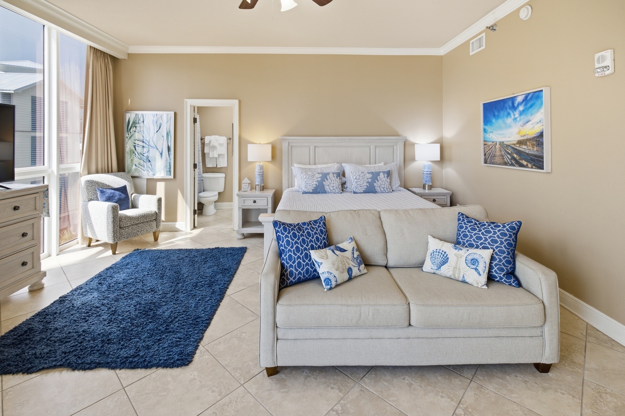 Coastal condo living room with blue accents