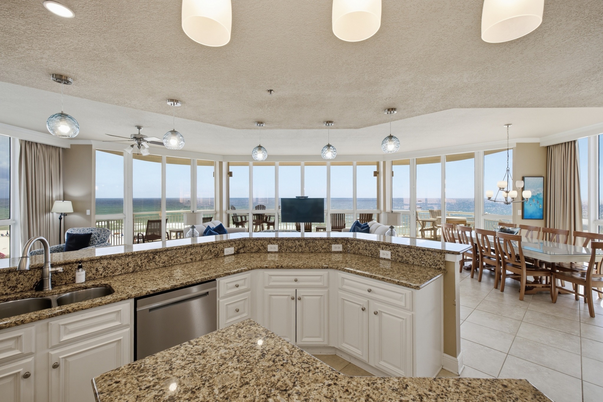 Coastal condo kitchen with panoramic water views