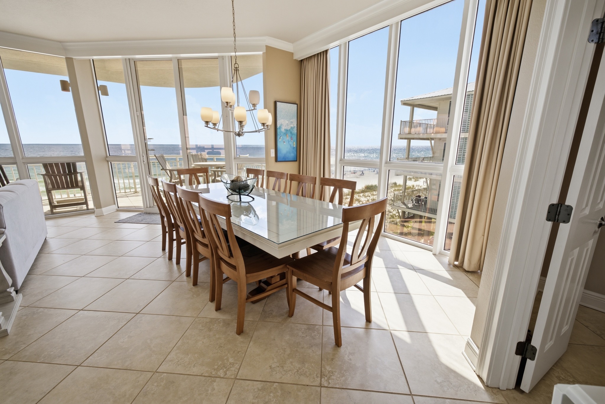 Coastal condo dining area overlooking the water