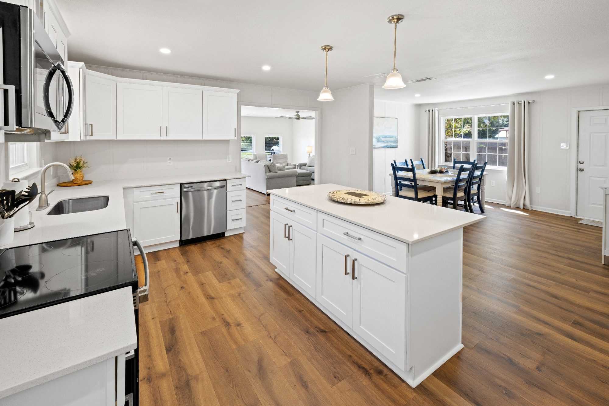 White kitchen open to the dining area
