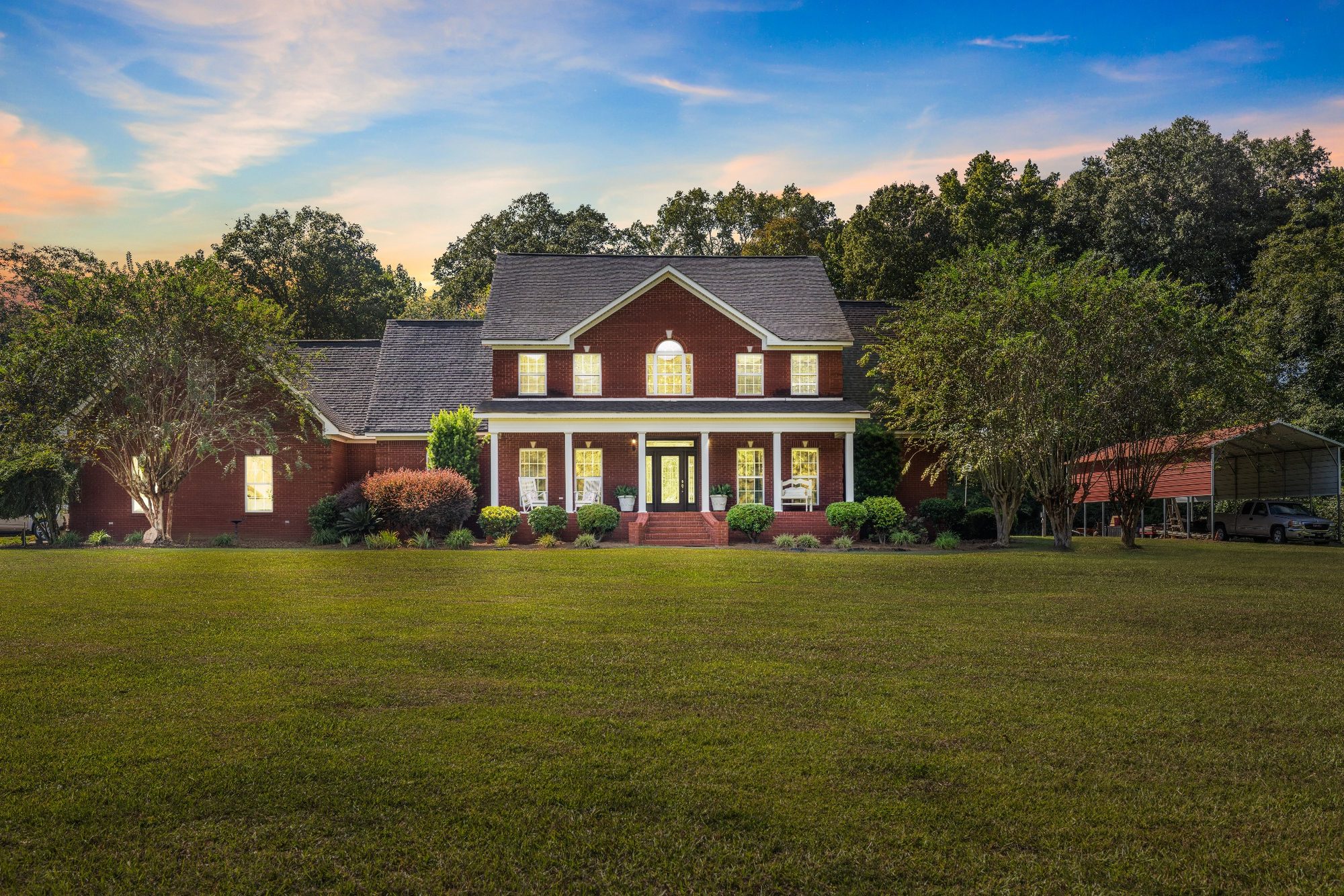 Twilight exterior of a brick home
